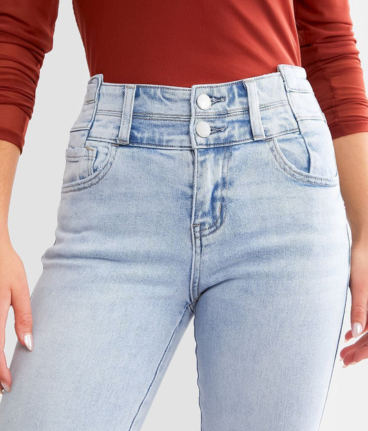 Pantaloni in denim elasticizzato con bottoni a vita alta da donna