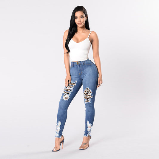 Pantaloni slim fit in denim con cuciture leopardate