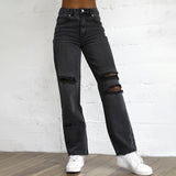 Pantaloni in denim da donna con buchi strappati