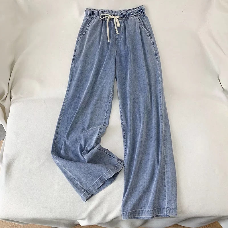 Pantaloni a gamba larga con coulisse in denim alla moda da donna