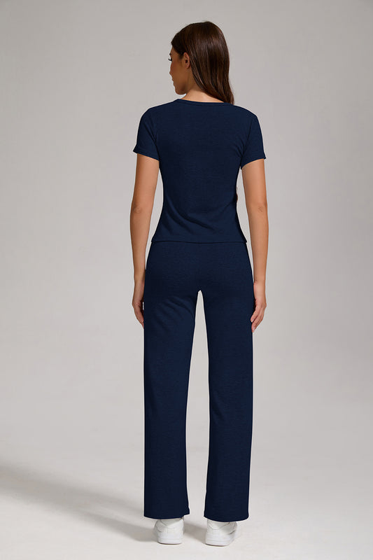 Completo sportivo casual da donna in due pezzi con bottoni sul collo a V