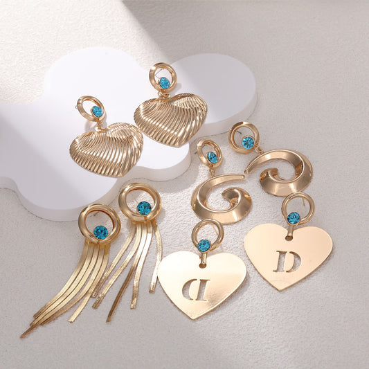 Orecchini da donna con zirconi intarsiati e diamanti a forma di cuore con nappa