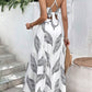 Completo due pezzi con canotta senza schienale con stampa tropicale e gonna con spacchi sulle cosce
