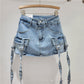 Gonna corta in denim con cintura sui fianchi primaverile ed estiva