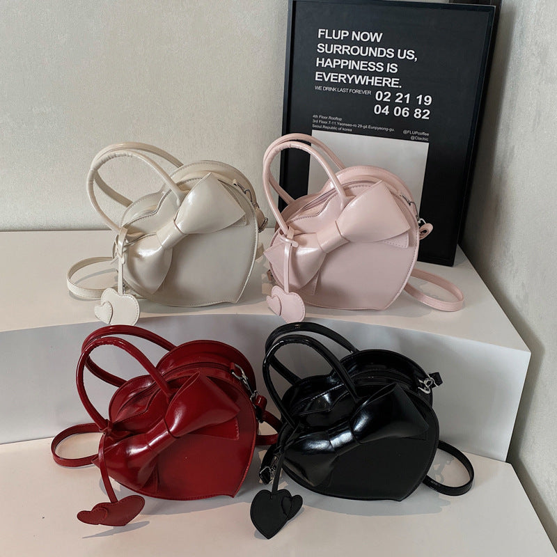 Borsa a tracolla portatile alla moda con fiocco a forma di cuore