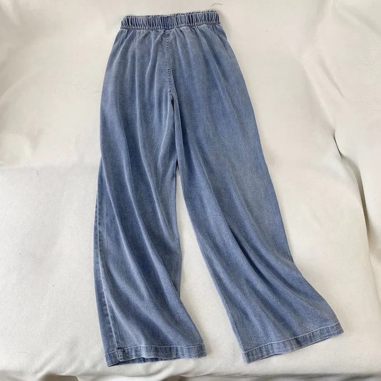 Pantaloni a gamba larga con coulisse in denim alla moda da donna
