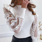 Blusa girocollo in rete traforata