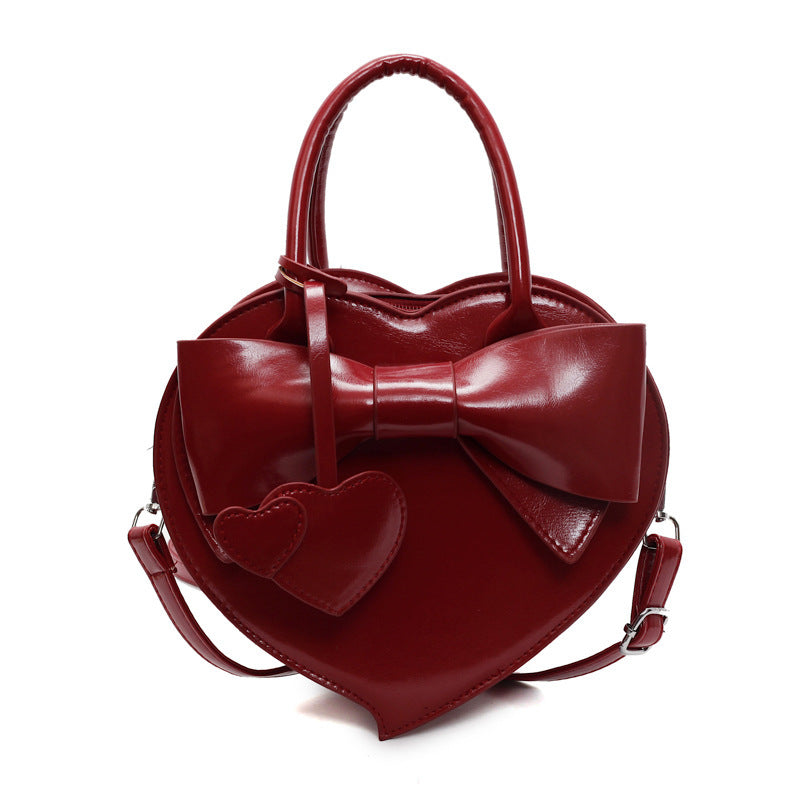 Borsa a tracolla portatile alla moda con fiocco a forma di cuore