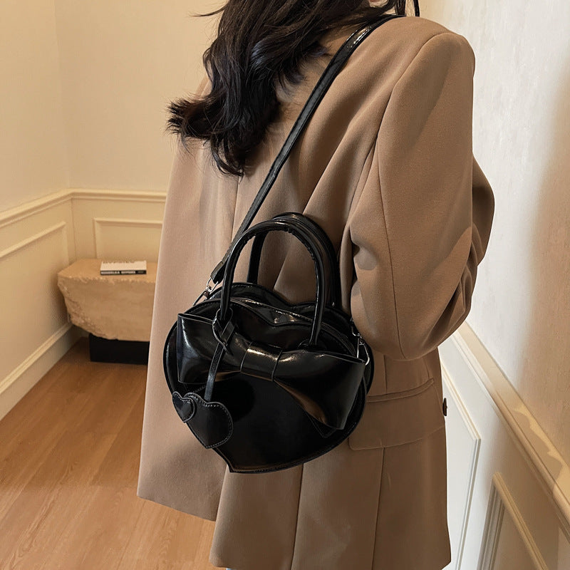 Borsa a tracolla portatile alla moda con fiocco a forma di cuore