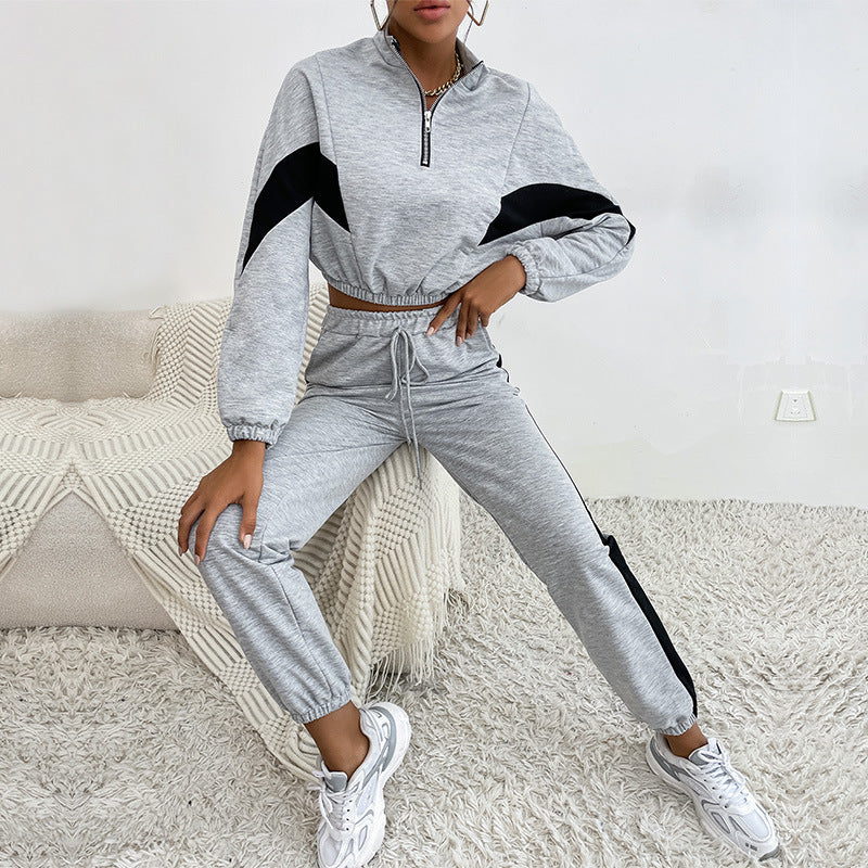 Completo sportivo da donna con colletto alto e felpa con colori a contrasto, due pezzi