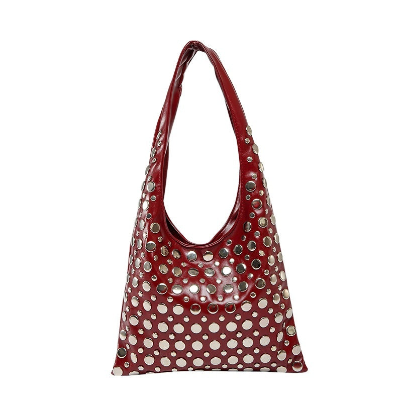 Borsa a tracolla con rivetti a pois da donna