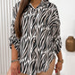 Camicia casual ampia con maniche arrotolate e stampa da donna