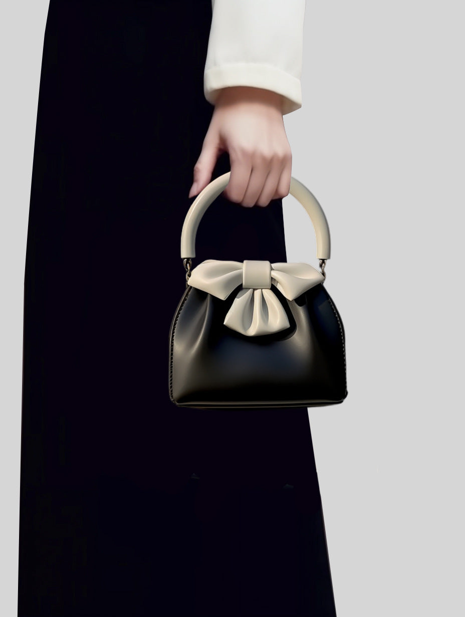 Borsa a secchiello con fiocco a contrasto di colore, da donna, plissettata
