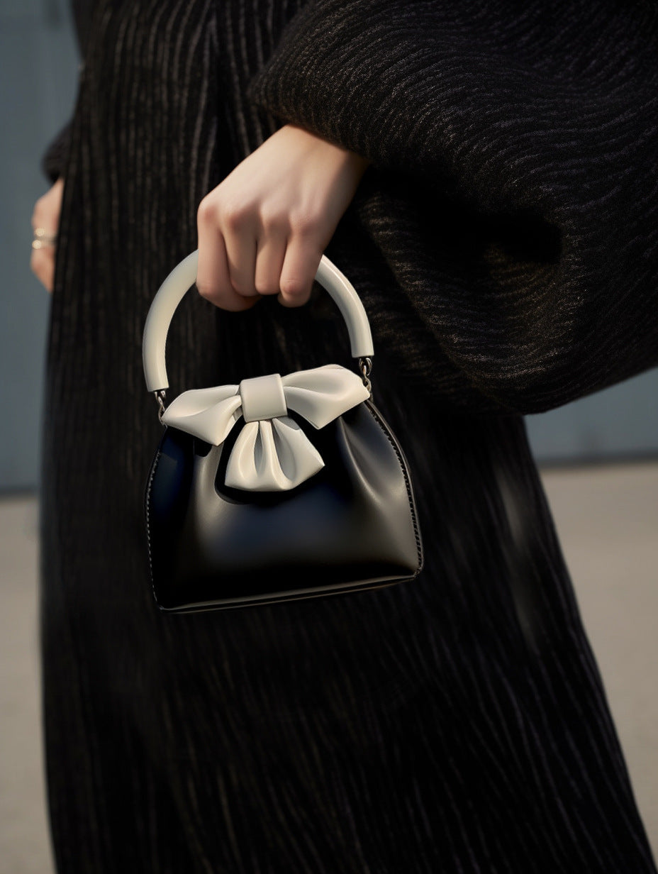 Borsa a secchiello con fiocco a contrasto di colore, da donna, plissettata